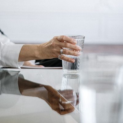 glass table with cup of water Photo by cottonbro from Pexels