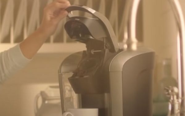 10. Lift the pod holder and then close it - FamilyGuideCentral.com