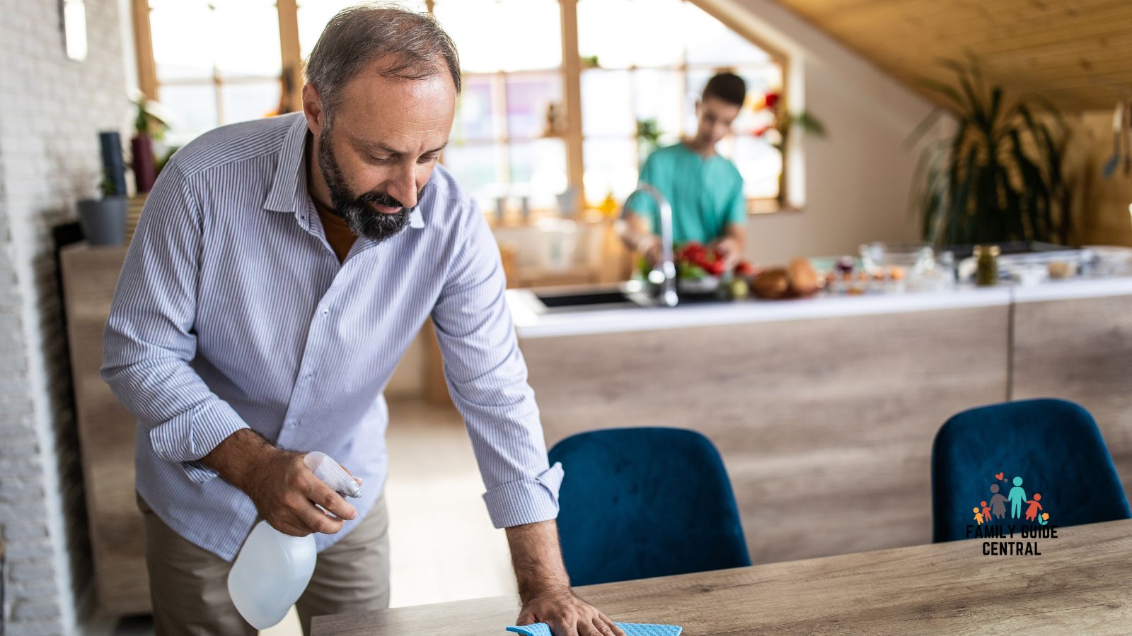 Man polishing a dining table - familyguidecentral.com