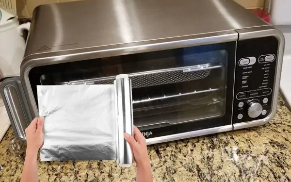 Aluminum foil in a ninja foodi air fryer - FamilyGuideCentral.com