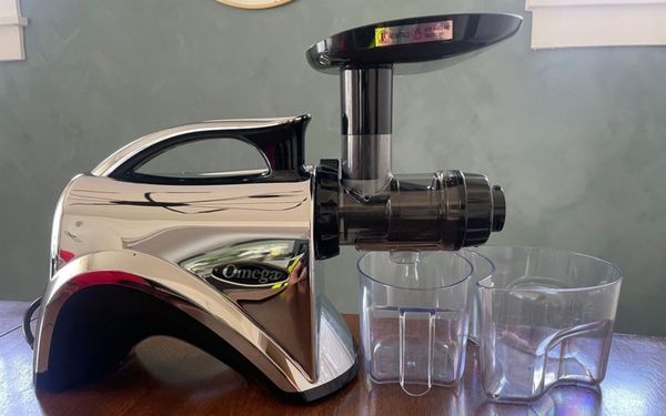 Omega juicer on a table - FamilyGuideCentral.com