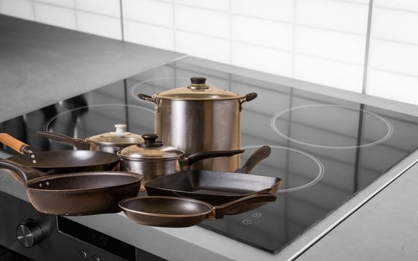 Pots and pans in induction stove - familyguidecentral.com