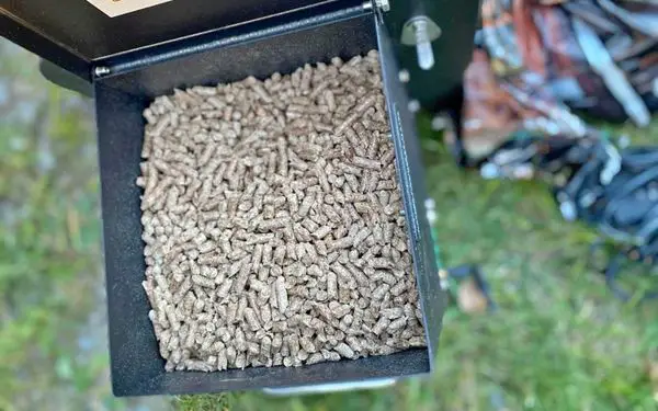Traeger hopper with wood pellets in it - familyguidecentral.com