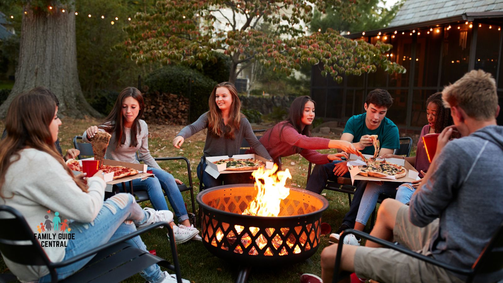 Outdoor fire pit with friends around it - familyguidecentral.com